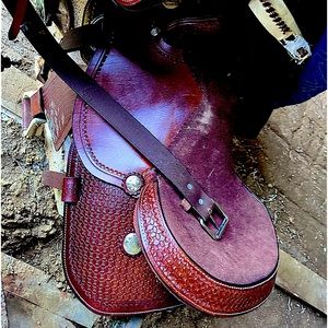 2 new west saddles never been on horse or used . both are 15.5in leather.